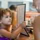 Mother and daughter ordering in restaurant